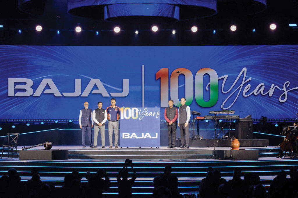 The Bajaj family unveils the '100 Years of Bajaj' logo at the event