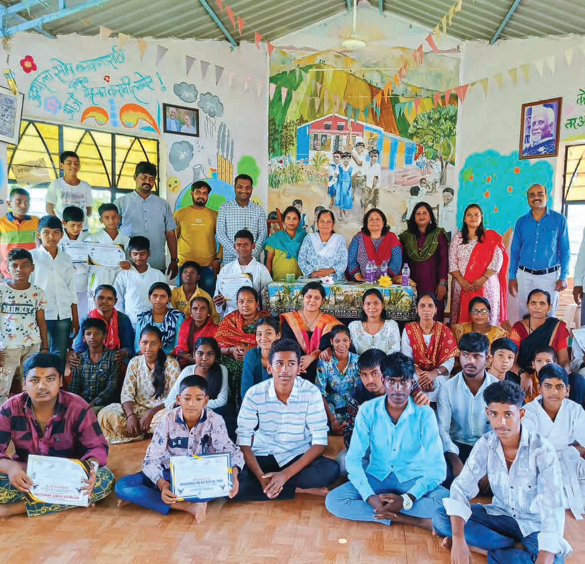 Children and staff at a Bajaj Finserv-supported child care institution during an awards ceremony.