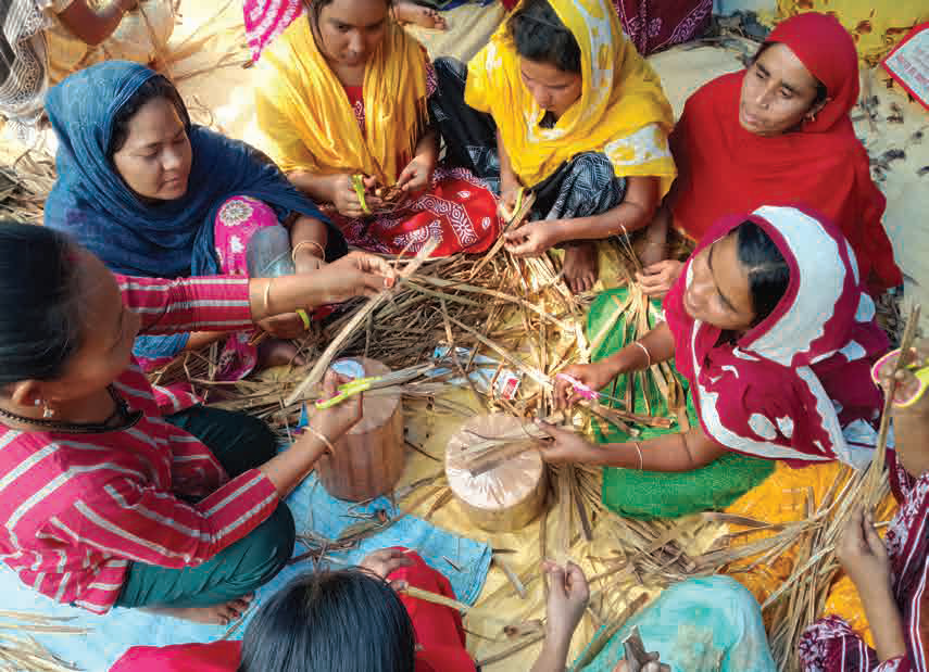 Women in rural West Bengal weaving water hyacinth products through Kadam India's skill development programme.