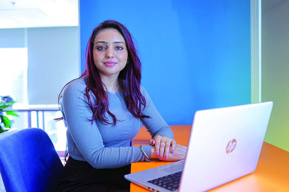 A Bajaj Finserv employee working at her desk.